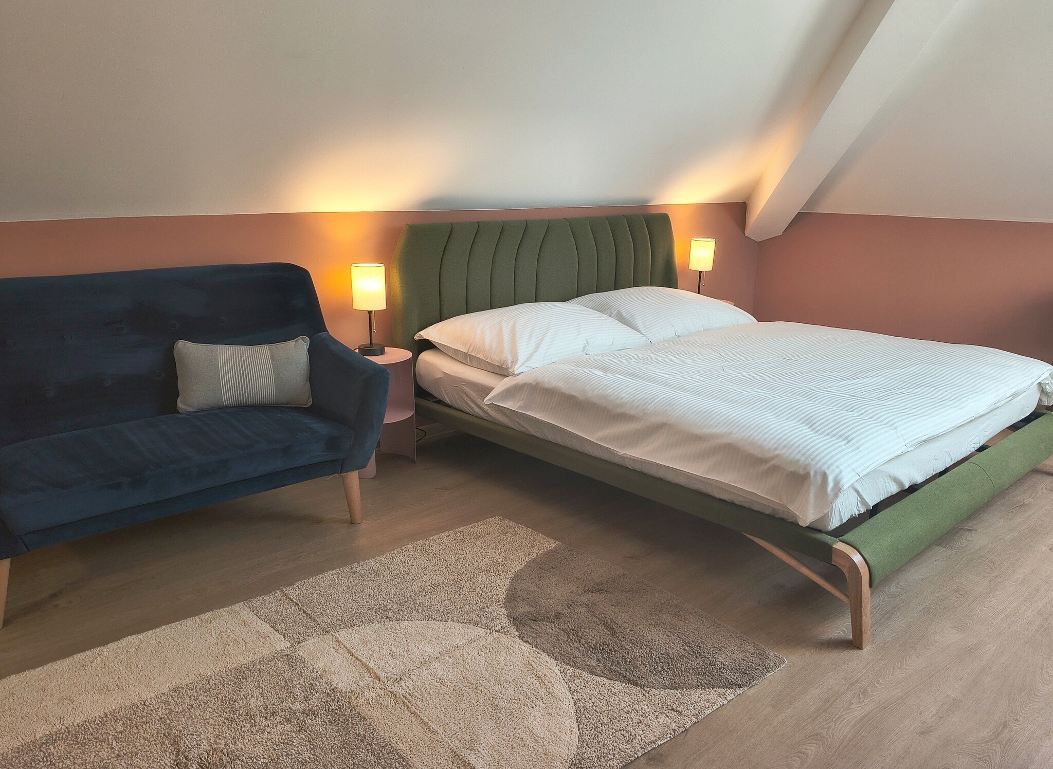King bed and sofa in studio 401