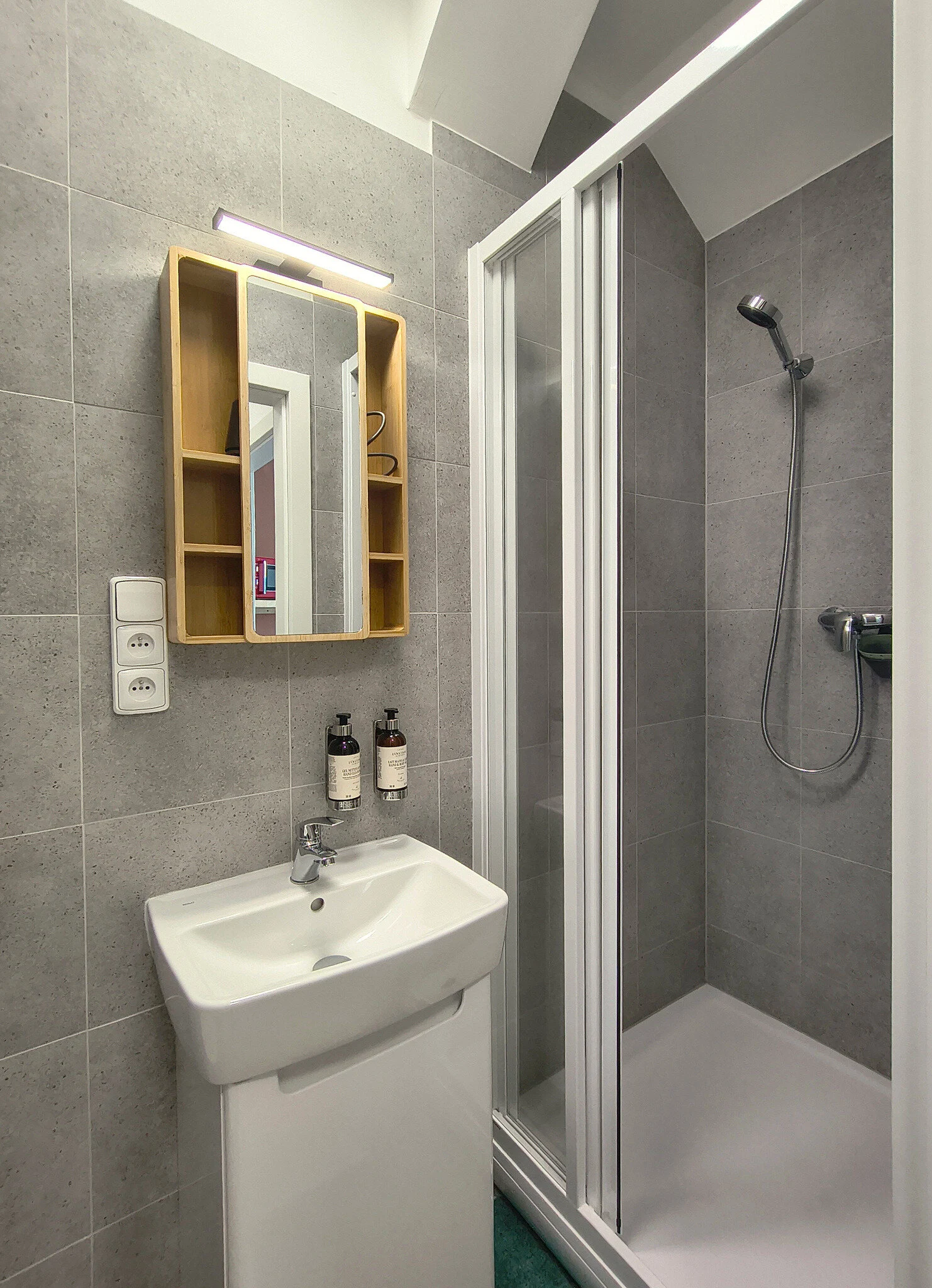Interior or bathroom photograph of room 406 at CHILL Apartments
